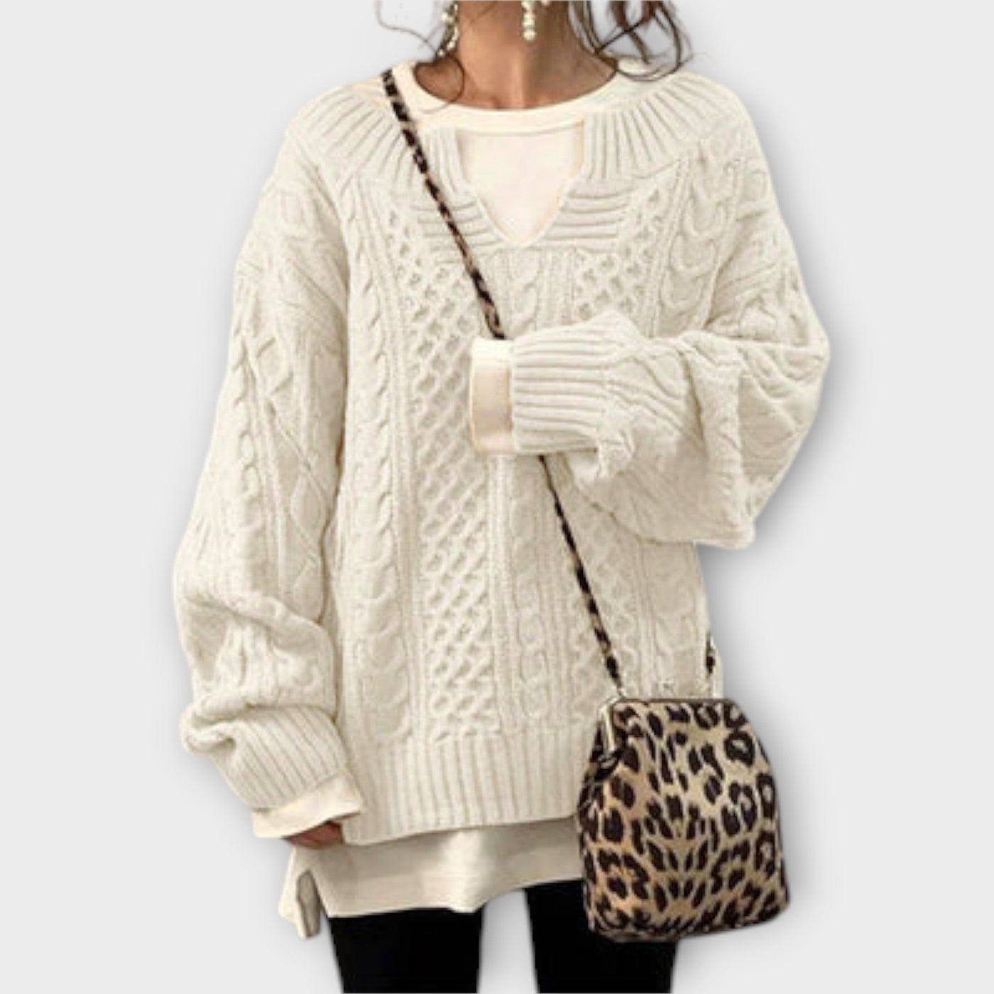 Oversized knitted sweater with cable pattern